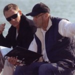 Daniel Craig and Martin Campbell go over the script on the Spirit '54